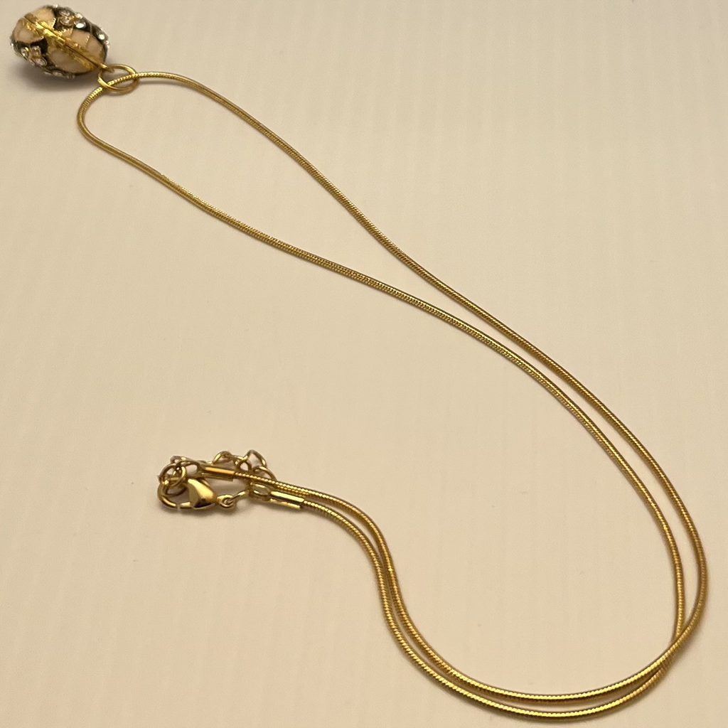 Gold Toned Swarosvki Crystal Egg Pendant Necklace