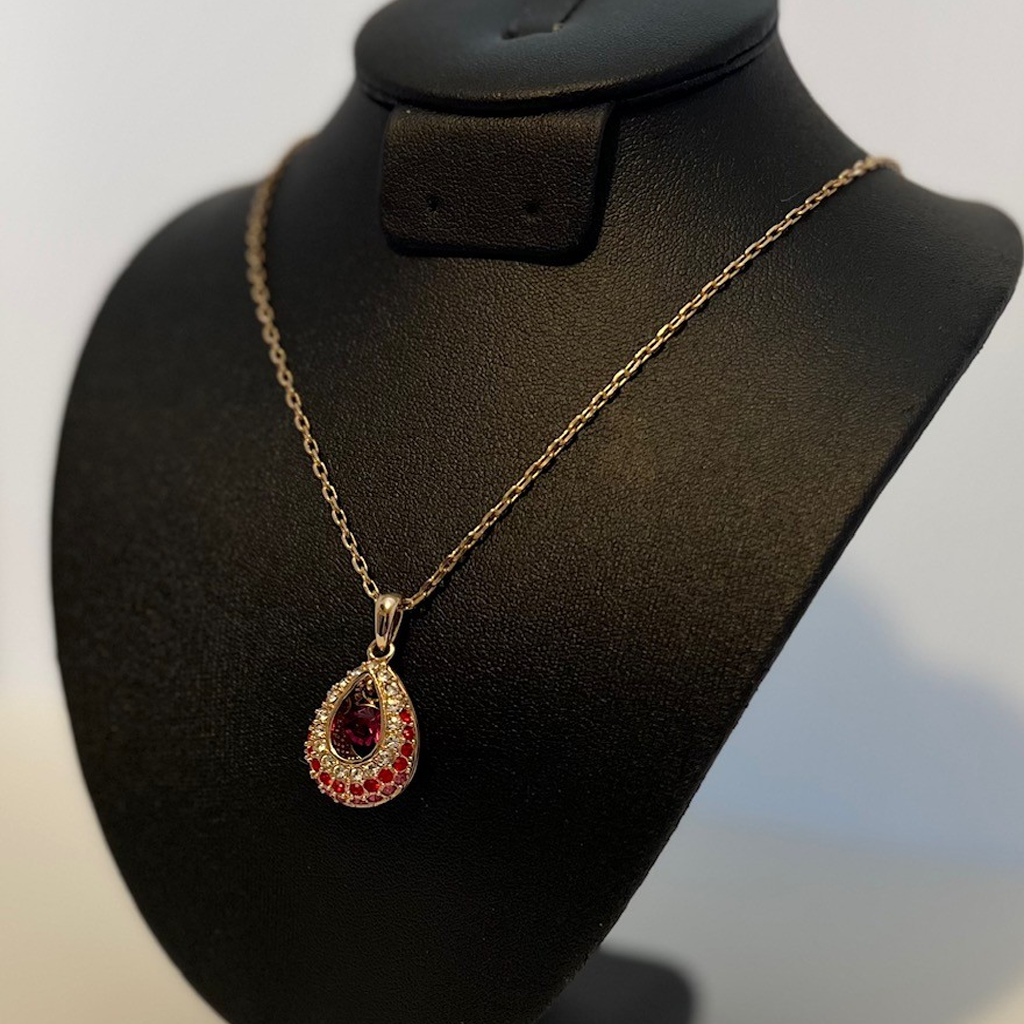Elegant Gold and Reddish-Pink Teardrop Pendant Necklace