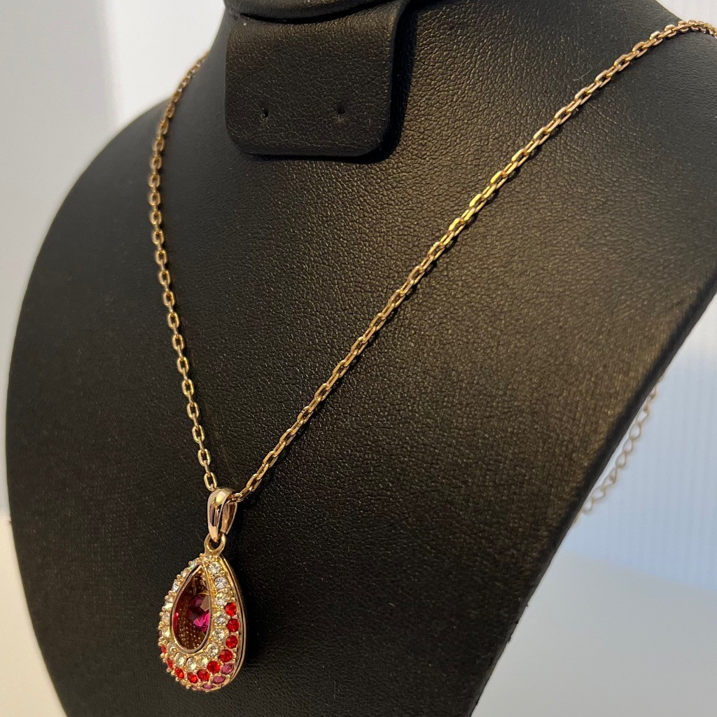 Elegant Gold and Reddish-Pink Teardrop Pendant Necklace