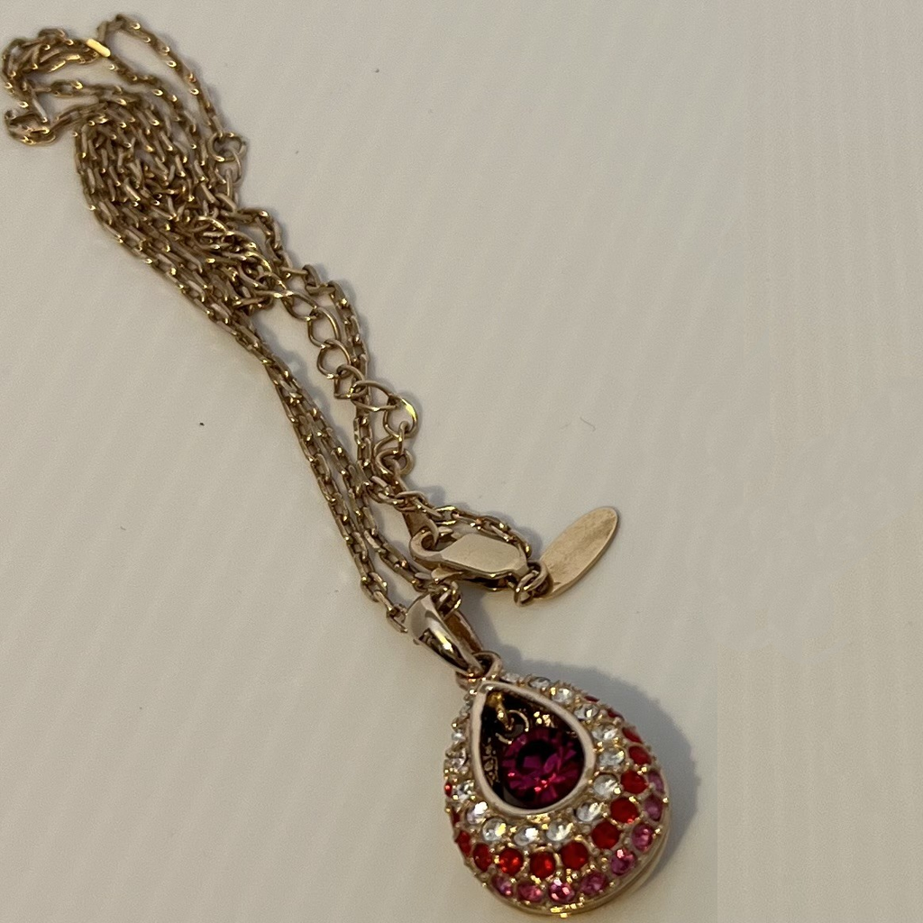Elegant Gold and Reddish-Pink Teardrop Pendant Necklace