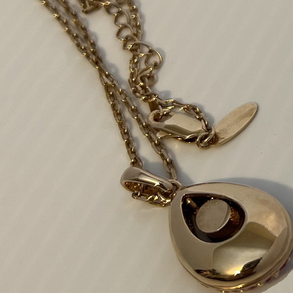 Elegant Gold and Reddish-Pink Teardrop Pendant Necklace