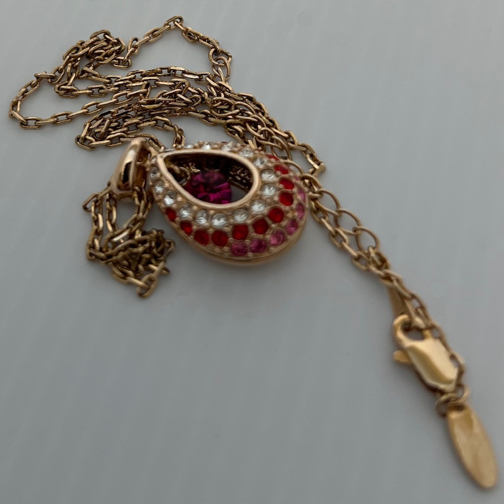Elegant Gold and Reddish-Pink Teardrop Pendant Necklace